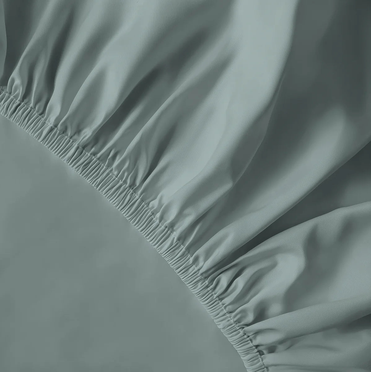 Menta zöld lepedő gumis része közelről